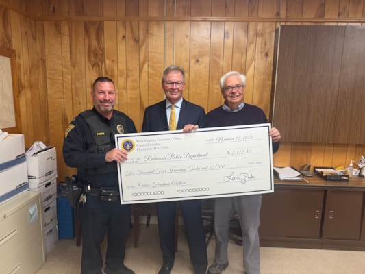 Treasurer Pack Presents More Than $2,000 to Richwood Police Department from September Online Firearms Auction
