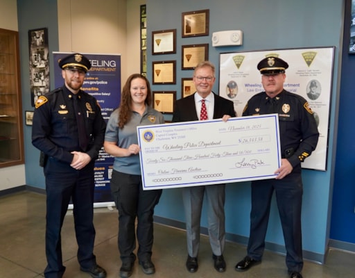 Treasurer Pack Presents More Than $26,000 to Wheeling Police Department from September Online Firearms Auction