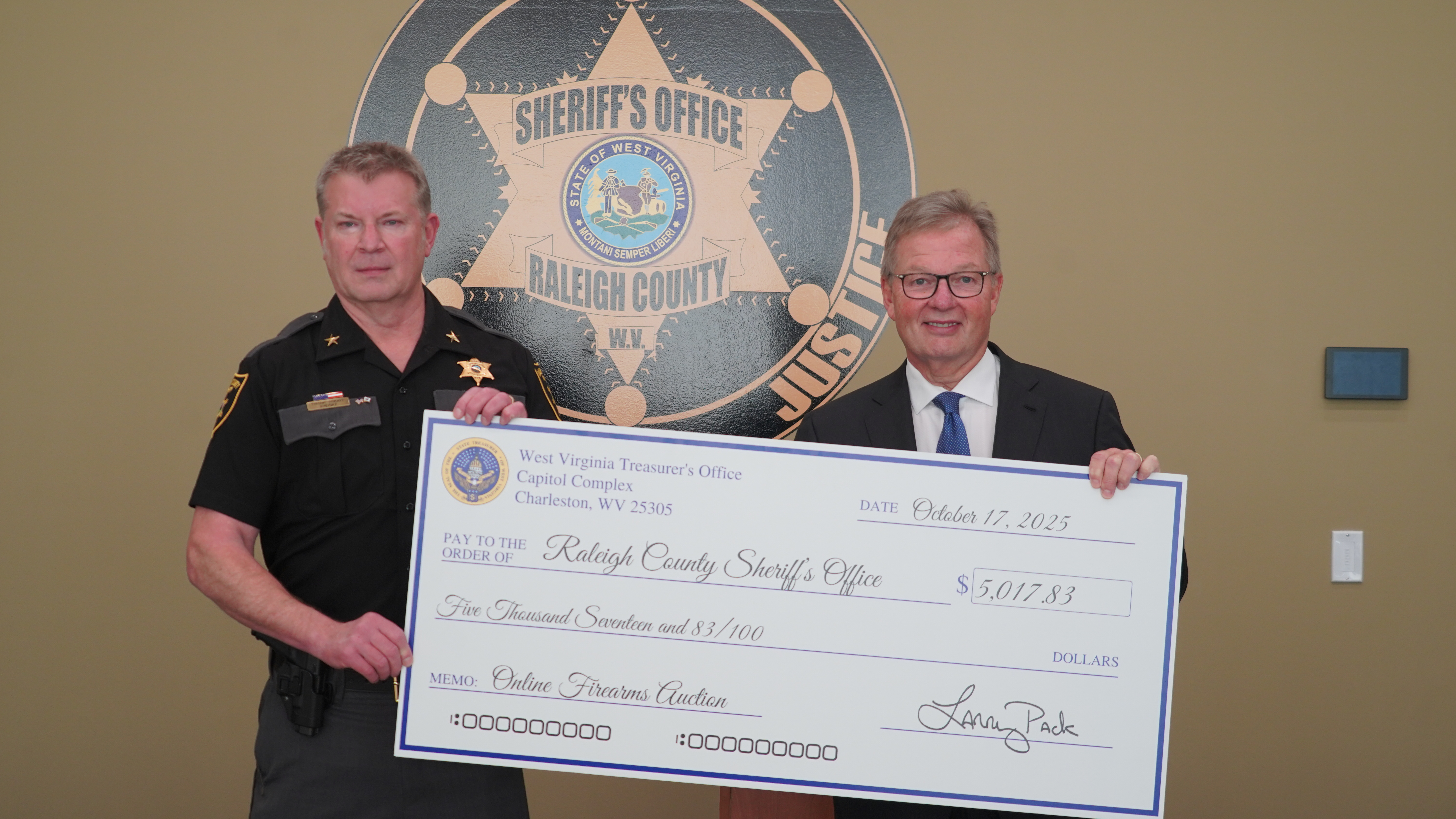 Treasurer Pack Presents More Than $5,000 to Raleigh County Sheriff’s Office from September Online Firearms Auction