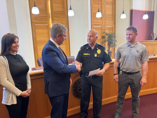 Treasurer Pack Returns Nearly $2,000 to Clarksburg Police Department from February Online Firearms Auction