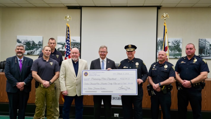 Treasurer Pack Returns More Than $16,000 to Parkersburg Police Department from February Online Firearms Auction